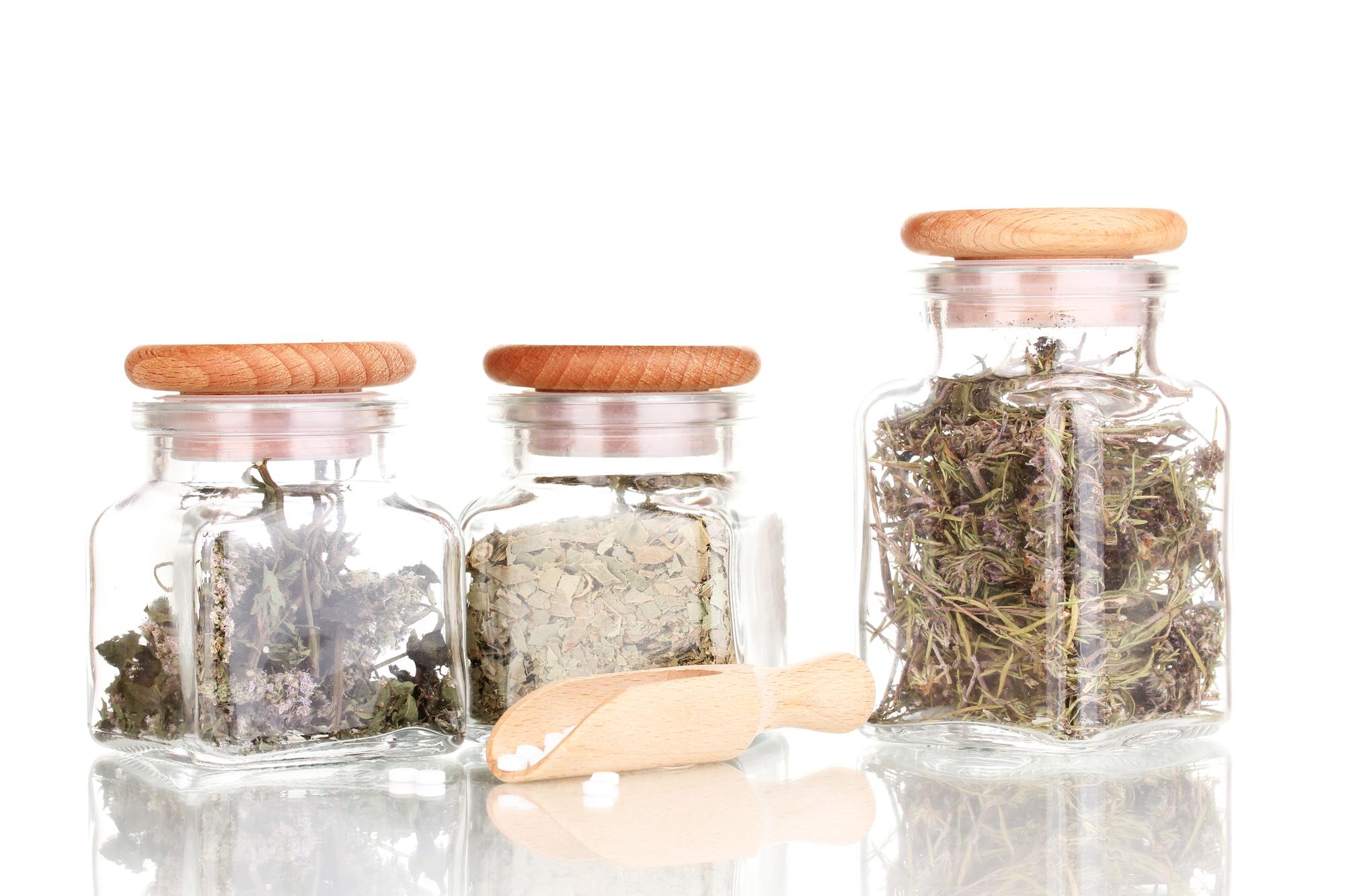 Herb garden and labeled jars in studio light