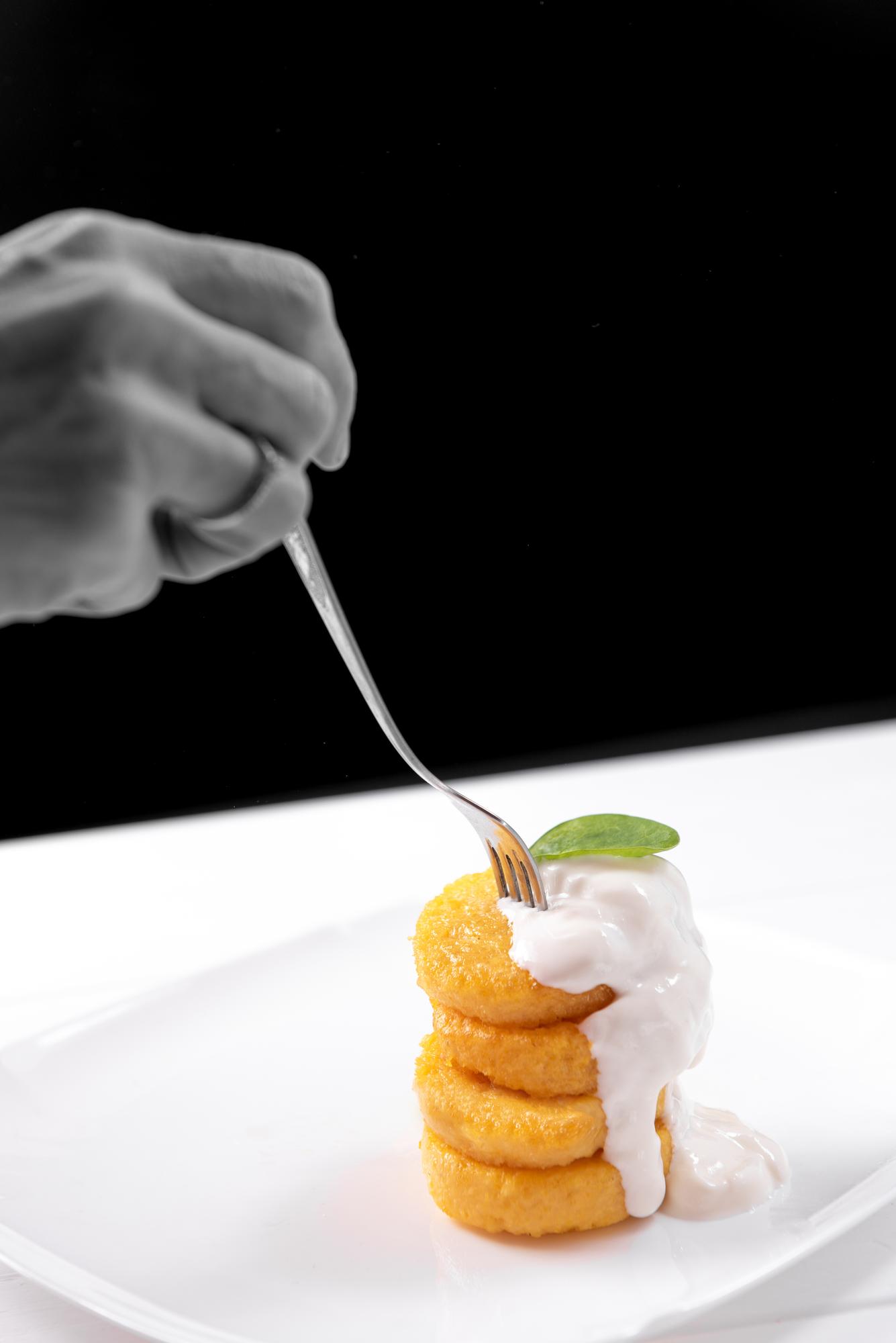 Chef plating a modern dish in a high-tech kitchen