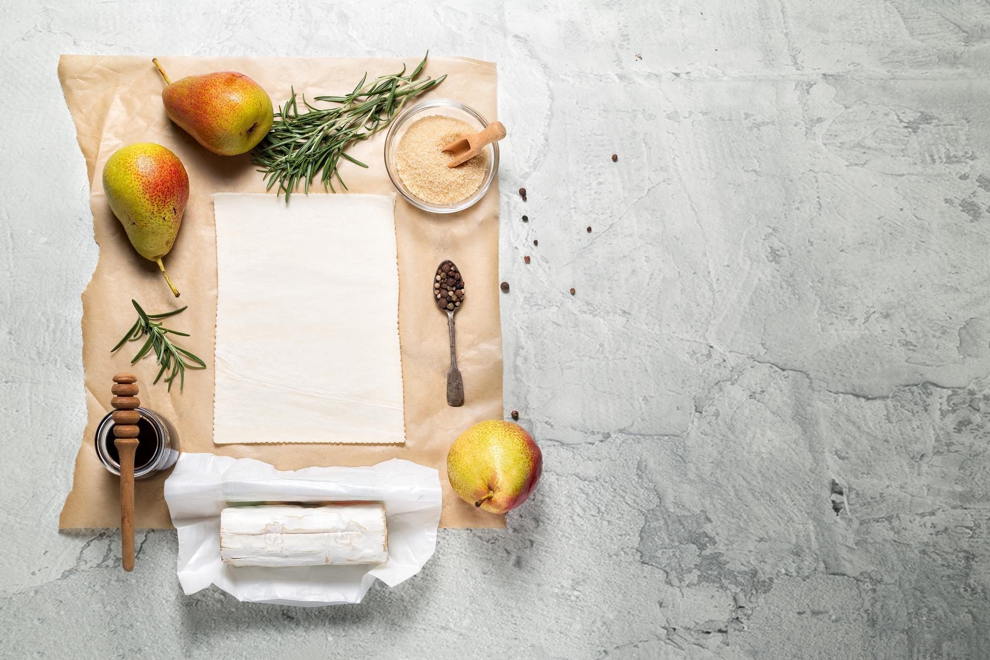 Flat lay of printed recipe cards and annotated photos